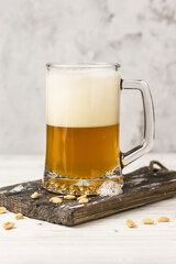 cold beer foam in a glass on a table