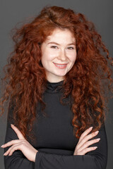 Portrait of a young beautiful red-haired woman