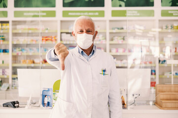 An old pharmacy worker displeased with number of sick people.