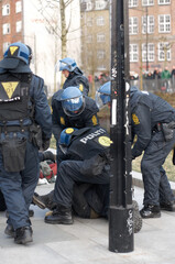 Enforcing the law. Policement arresting a suspect.