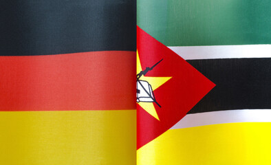 fragments of the national flags of Germany and Mozambique in close-up