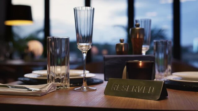 Cutlery on reserved table in luxury restaurant without people. Dinner concept.