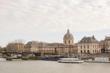 View of the left bank of the Seine with Institut de France in Paris, France