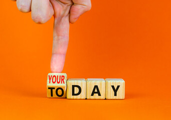 Today is your day symbol. Businessman turns the wooden cube and changes concept words Today to your day. Beautiful orange background, copy space. Business, motivation today is your day concept.