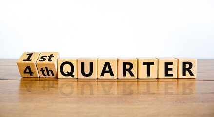 From 4th forth to 1st first quarter symbol. Turned wooden cubes and changed words 4th quarter to 1st quarter. Beautiful wooden table white background. Business happy 1st quarter concept, copy space. - obrazy, fototapety, plakaty