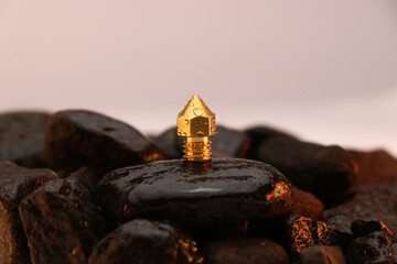 3D printer brass nozzle on a wet stone, Spare parts for 3d printer machine