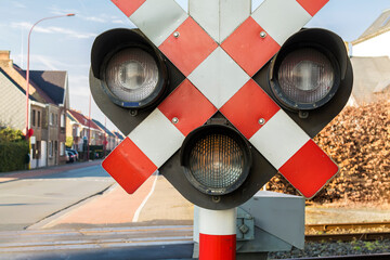 Warning sign and lamps at railroad crossing, Gavere, east flanders, Belgium 