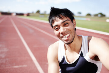 Hes got a winning smile. Portrait of a smiling young sportsman.