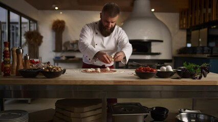 Pizza chef man cooking italian dinner recipe in kitchen. Baker put mozzarella.