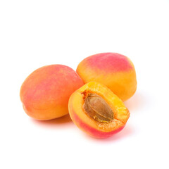 Ripe fresh apricots isolated on white background