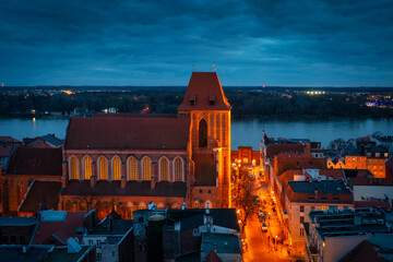 Architecture of the old town in Torun at dusk, Poland. - obrazy, fototapety, plakaty