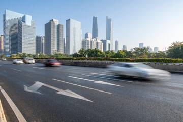Cars driving at high speeds on the skyline and highways of Guangzhou, China