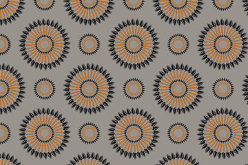 Abstract seamless pattern, the element is taken from a real photo. The ornament is colored, consists of small garden shovels in the shape of a circle of different sizes on a gray background.