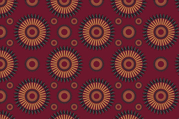 Abstract seamless pattern, the element is taken from a real photo. The ornament is colored, consists of small garden blades in the form of a circle on a burgundy background. Concept: fabric print.