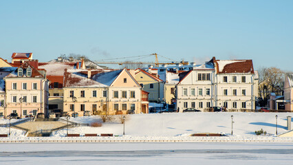Panoramic view of old building in historical center of Minsk. Historical building near the frozen river.