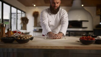 Culinary chef cooking pizza dough in restaurant kitchen. Pastry recipe concept.