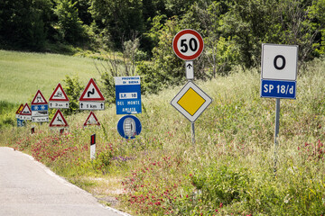 Regulation by many different road signs along the road