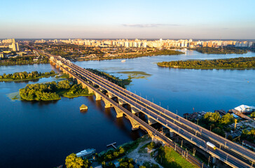 Fototapeta premium Aerial view of the Darnytsia arch bridges across the Dnieper in Kiev, Ukraine