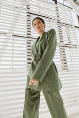 Beautiful and stylish girl with Asian appearance in a minimalist interior