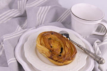 Raisin Cinnamon bun on white background
