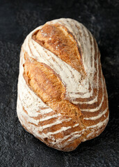 Bread, traditional sourdough bread on a rustic table
