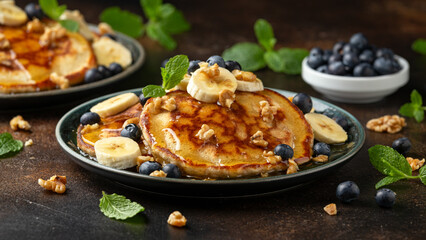 American pancakes with banana, blueberry, walnut and honey. Healthy morning breakfast