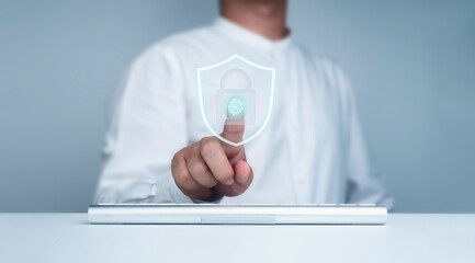 Fingerprint scan and shield, lock icon appeared on virtual screen while businessman's finger...