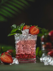 Fresh lemonade with ice, mint and strawberry. Iced tea with strawberries and mint. On a white background.