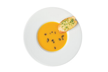 Pumpkin Soup in a white cup and bread