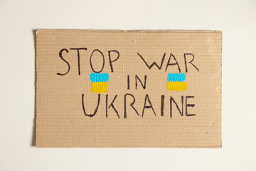 Stop the war in Ukraine written on a sign from a house in Ukraine, protest action, martial law