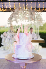 Beautiful wedding cake for the newlyweds at the wedding. A birthday cake at a banquet.