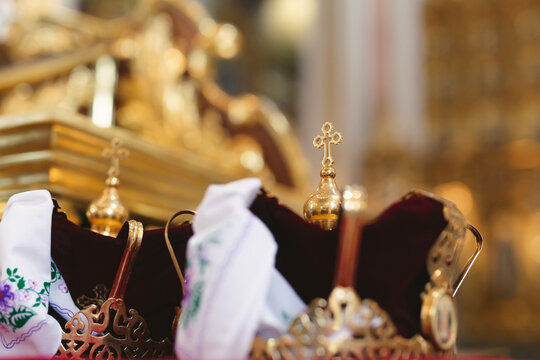 Wedding golden crowns ready for wedding ceremony in orthodox church.