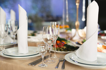 Beautiful setting of the wedding banquet table in the restaurant.