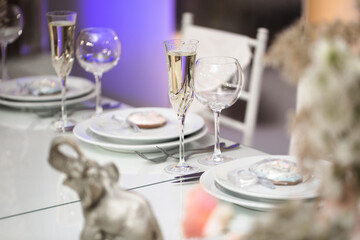 Serving a wedding banquet table in a restaurant with initials, name and date.