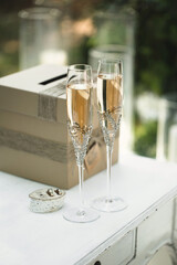 Champagne glasses on the table for painting at the wedding ceremony.