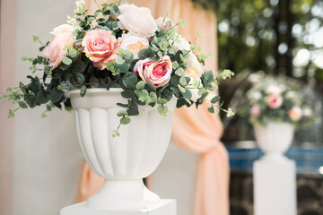 Details. Wedding ceremony in the open air of fresh flowers, with candles. Gentle and beautiful wedding decor for newlyweds.