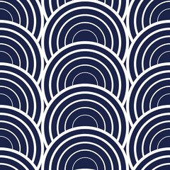 Pattern of white circles on a blue background. Vector seamless pattern.