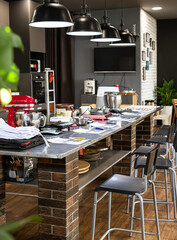 Preparation for the culinary class. Culinary master class in the culinary academy. Various household appliances are on the table with materials for work.