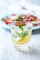 Close up of Limeade in a glass. Bright wooden background. 