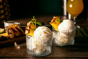 Delicious pineapple ice cream sorbet sundae. Summer food concept.