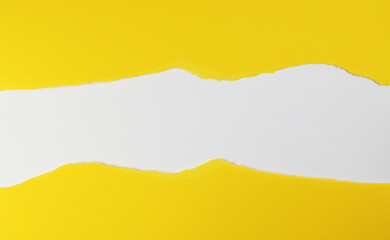 Yellow paper with torn edges isolated with white colored paper background inside. Good paper texture