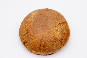 Loaf of rye bread on white background