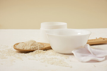 white bowls with rice and rice water, fermented skin and hair care products, organic cosmetics, light background