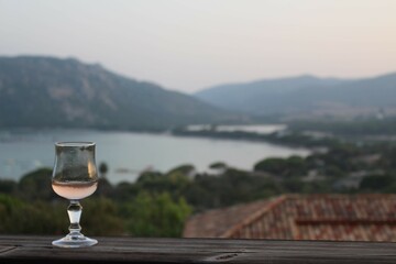glass of wine on balcony in the summer