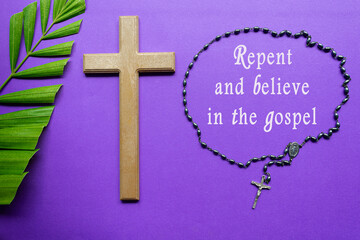 Cross and palm leaves with text on purple background. Holy week concept.