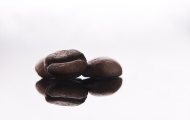 For lovers of coffee. Studio shot of coffee beans against a grey background.