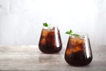 iced tea and cold mint on a gray background, there is a place to record