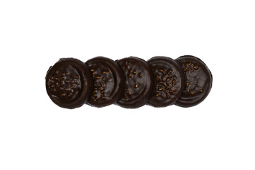 A row of cookies covered with chocolate and nuts, isolated on a white background