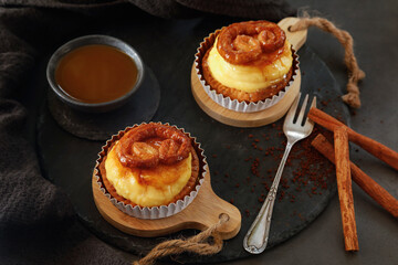 Delicious mini pastry cream tarts on dark background