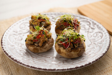 Oven-cooked mushrooms stuffed with tuna and red pepper.